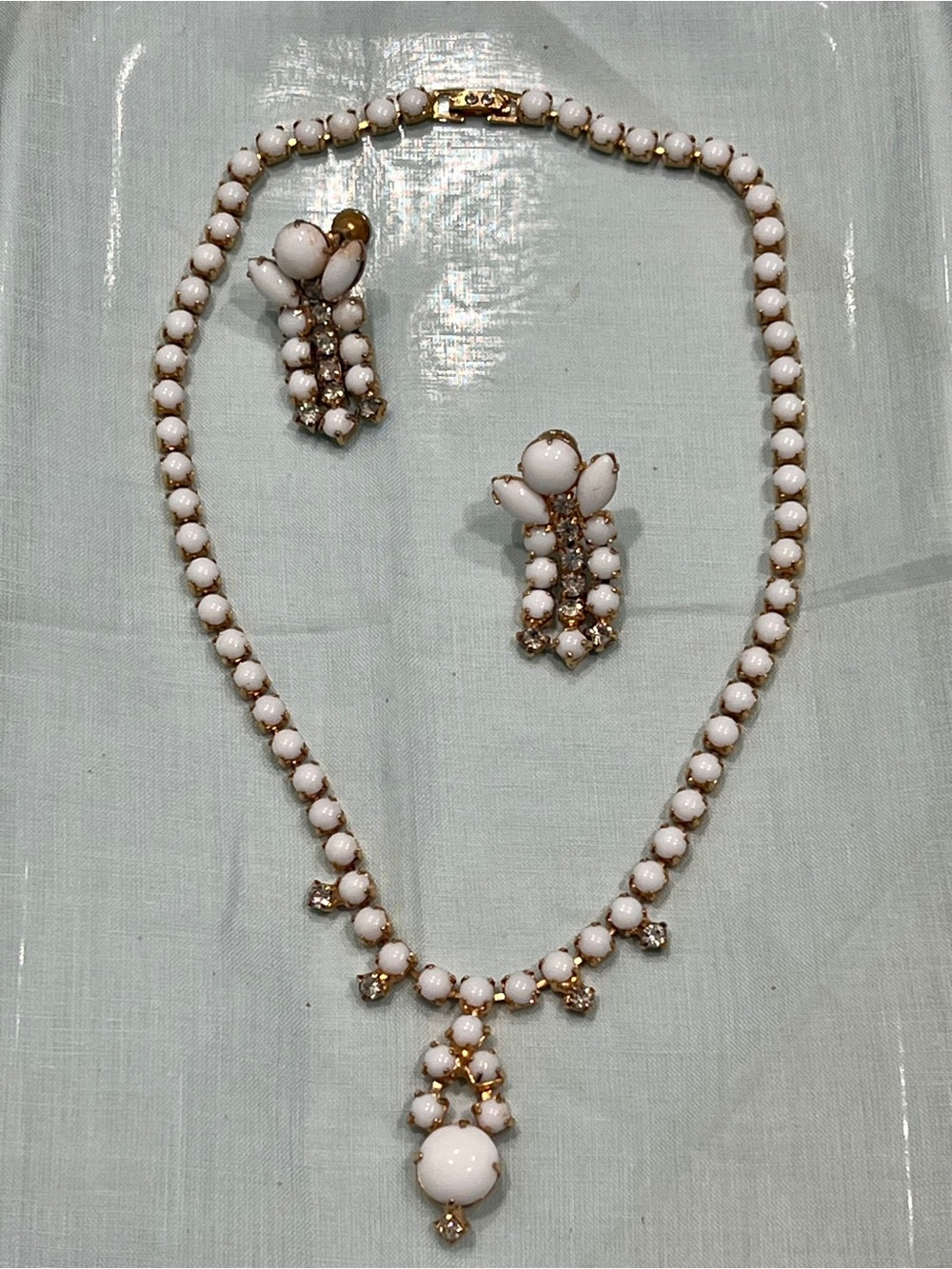 VTG Milk Glass And Clear
Rhinestone Set/ 15in
Approximately, Screw Back